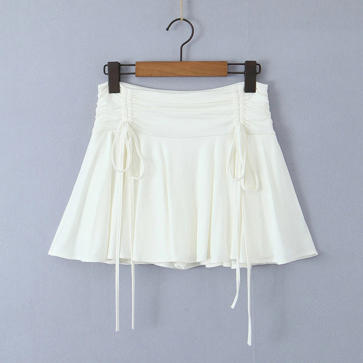 2023 Summer Y2K Style Cool Girl Asymmetrical Pleated Mini Skirts Women Rope Lacing Up Bandage Bow Waist Skirts White Black