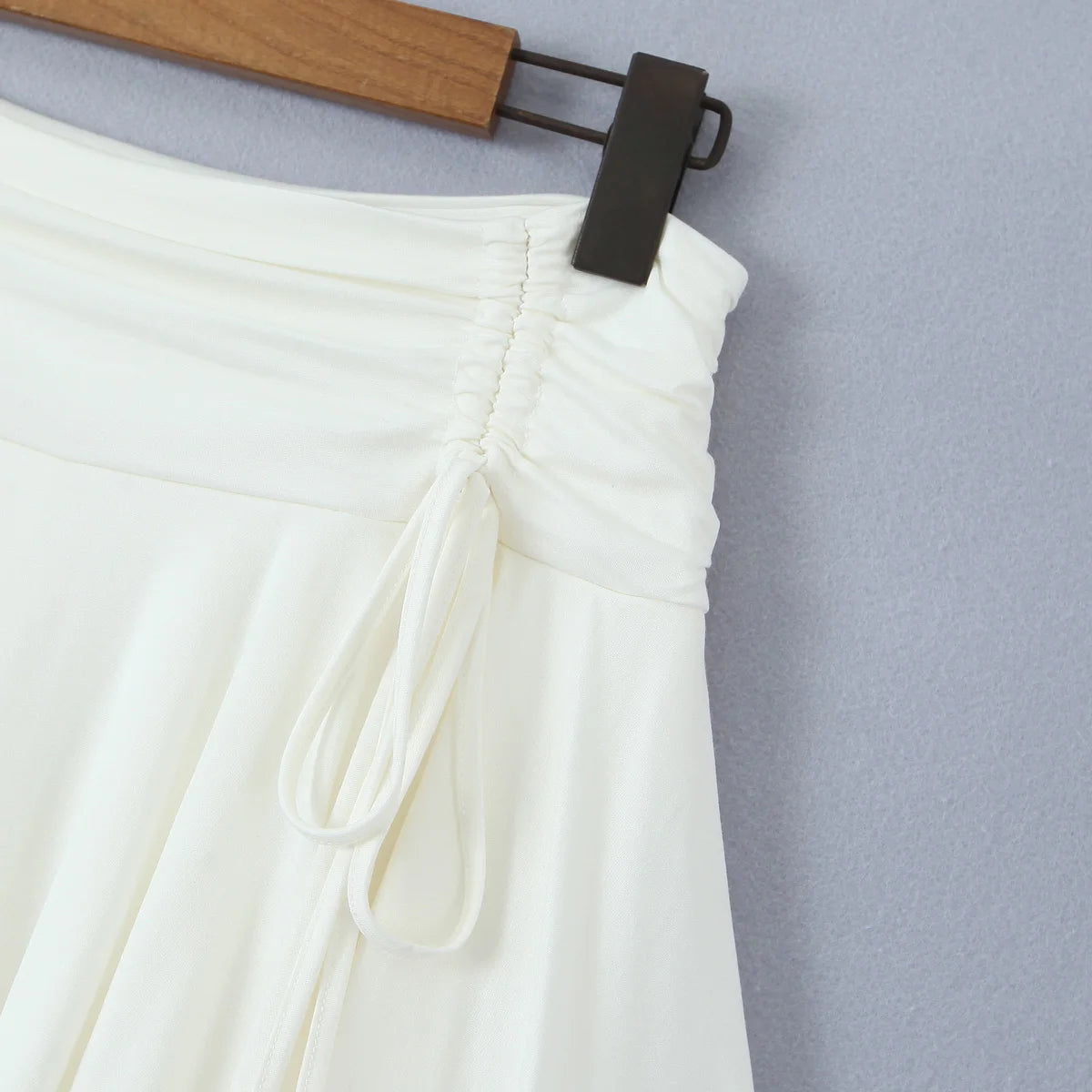 2023 Summer Y2K Style Cool Girl Asymmetrical Pleated Mini Skirts Women Rope Lacing Up Bandage Bow Waist Skirts White Black
